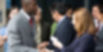 Two people talking to each other in a professional manner and exchanging business cards, they are trying to build a professional network